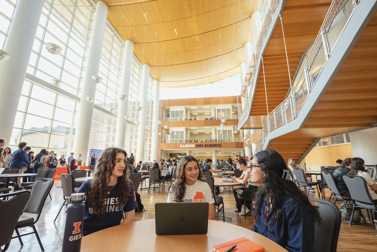 Gies Business students studying and talking in the BIF atrium.